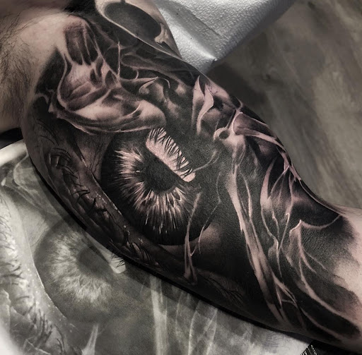 Explore bass tattoo ideas, creative tattoo ideas in Norcross, available at JP Alfonso Studios