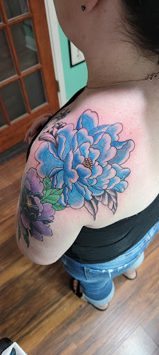 Explore garfield tattoo ideas, creative tattoo ideas in Erie, available at Lake Effect Tattoo Parlour