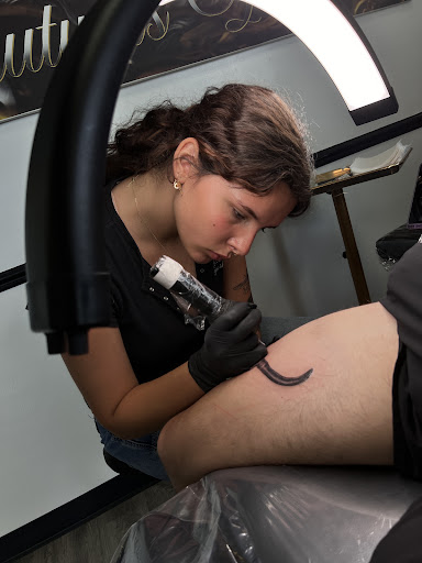 Explore feminine neck tattoo ideas, creative tattoo ideas in Milwaukee, available at Beauty is Pain Tattoo and Body Piercings