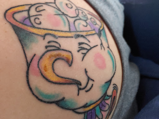 Explore middle of boob tattoo ideas, creative tattoo ideas in Saratoga Springs, available at Battlefield Piercing and Tattoo