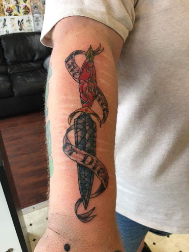 Explore batman logo tattoo ideas, creative tattoo ideas in Seymour, available at American Gypsy Tattoo Corp.