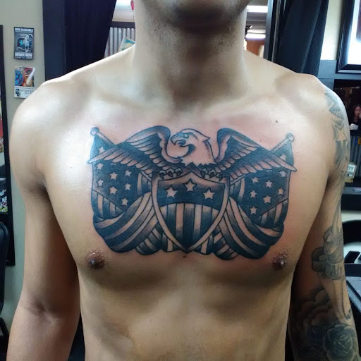 Explore tattoo ideas for dark skin men, creative tattoo ideas in Ozark, available at Tooth & Nail Tattoo & Piercing