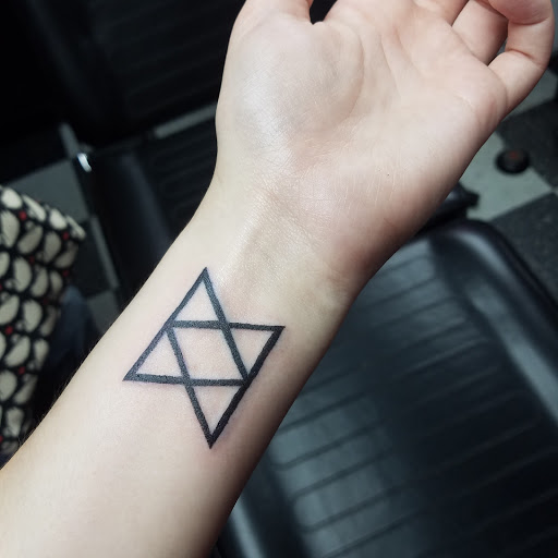 Explore split personality tattoo ideas, creative tattoo ideas in Dayton, available at Monkey Bones Tattoos