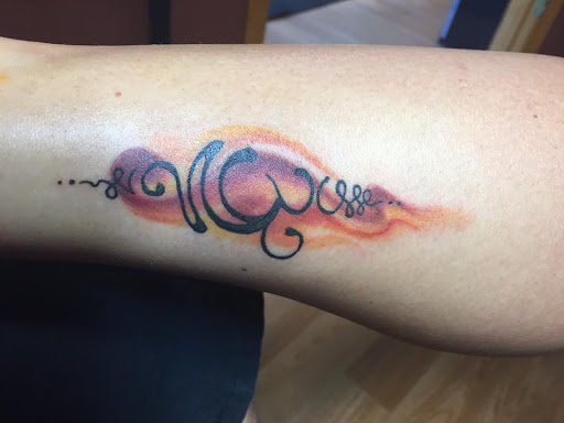 Explore dog print tattoo ideas, creative tattoo ideas in Tarpon Springs, available at Legendary Custom Tattoos and Piercings