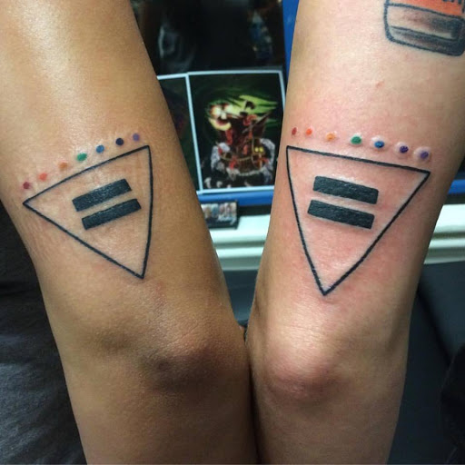 Explore safety pin tattoo ideas, creative tattoo ideas in Chapel Hill, available at Golden Falcon Tattoo and Piercing