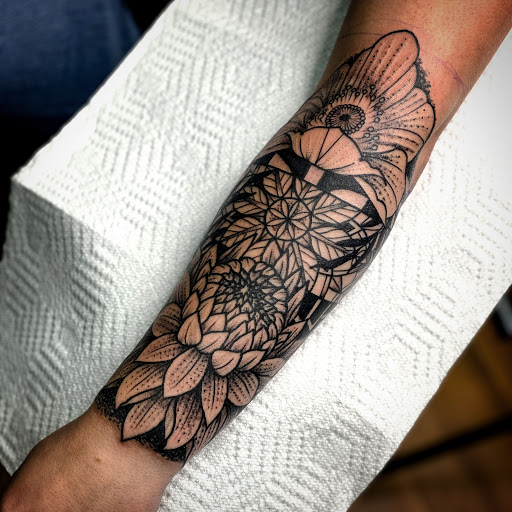 Explore arm tattoo placement ideas, creative tattoo ideas in Elkview, available at Andy Electric Tattoos