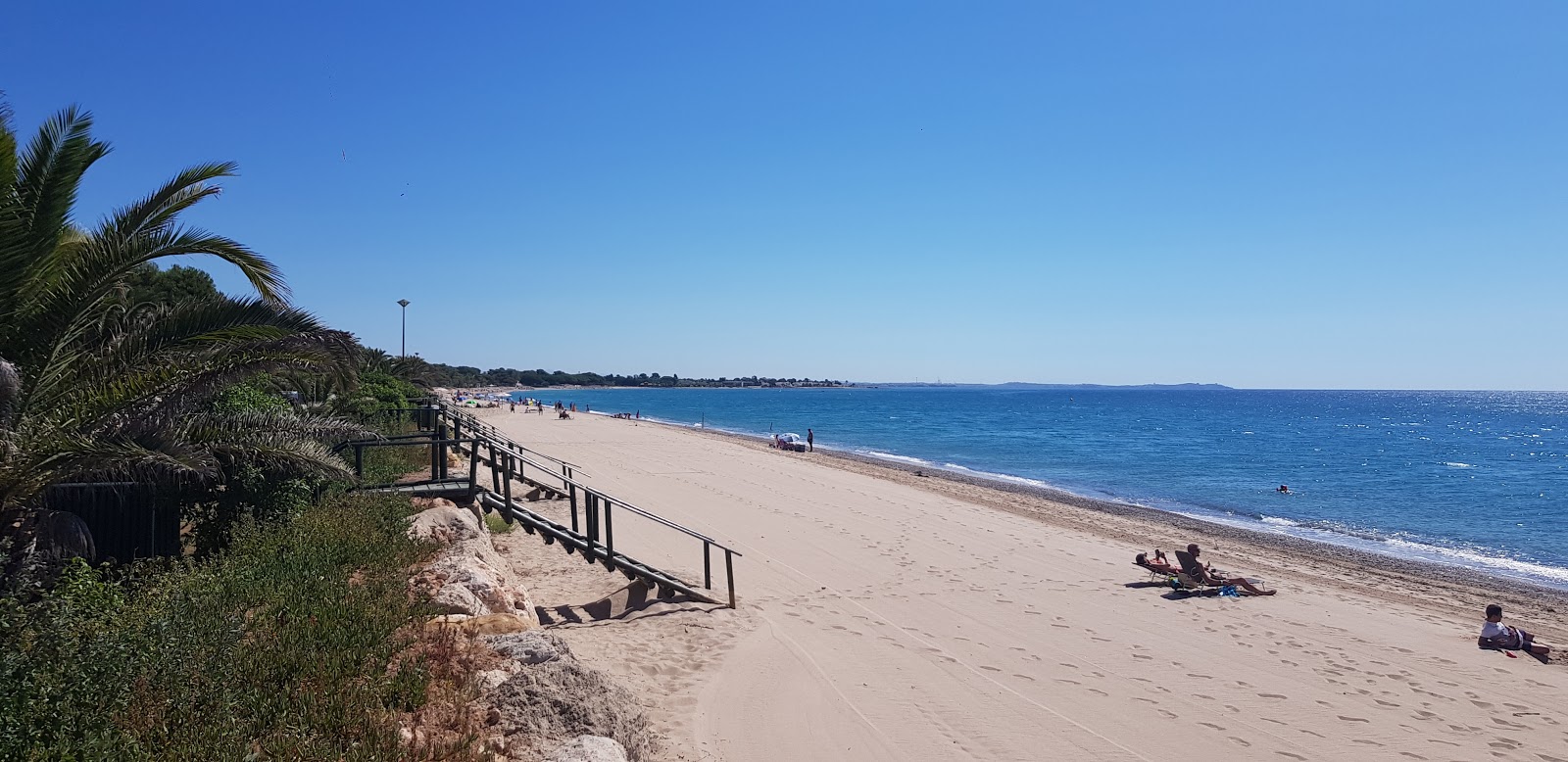 Zdjęcie Platja dels Pilans z powierzchnią beżowy piasek