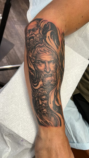 Explore cool hand tattoo ideas, creative tattoo ideas in Sarasota, available at Oddity Tattoo Art University