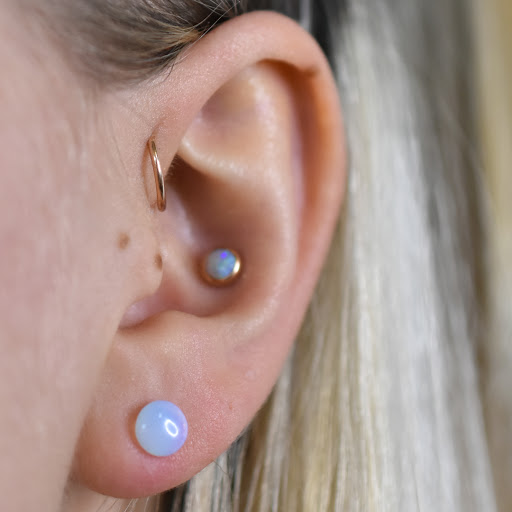 Find angel tattoo ideas for ladies for your next unique tattoo in Reno at Black Hole Body Piercing