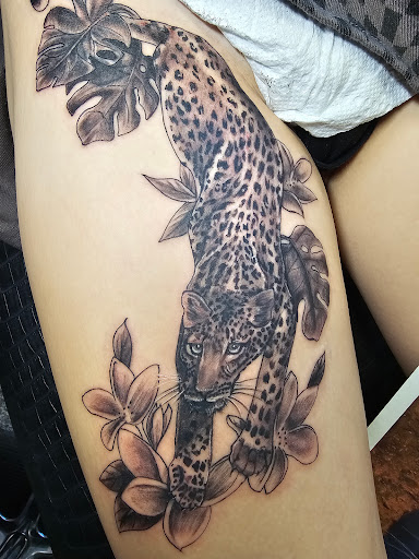 Explore tattoo ideas behind the ear tattoos, creative tattoo ideas in Saint Paul, available at Iron Rhino Tattoo