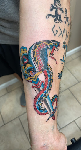 Explore tattoo ideas on leg for men, creative tattoo ideas in Hays, available at Blue Light Body Arts