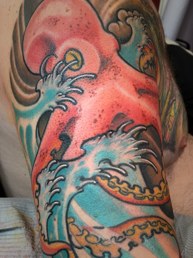 Explore triskelion tattoo ideas, creative tattoo ideas in Katy, available at Artistic Impressions Tattoo Studio