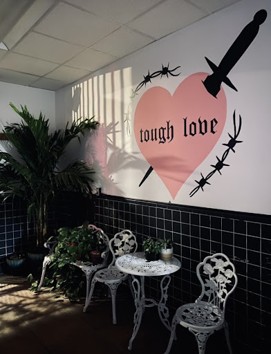 Explore black tattoo cover up ideas, creative tattoo ideas in New Orleans, available at TOUGH LOVE TATTOOS