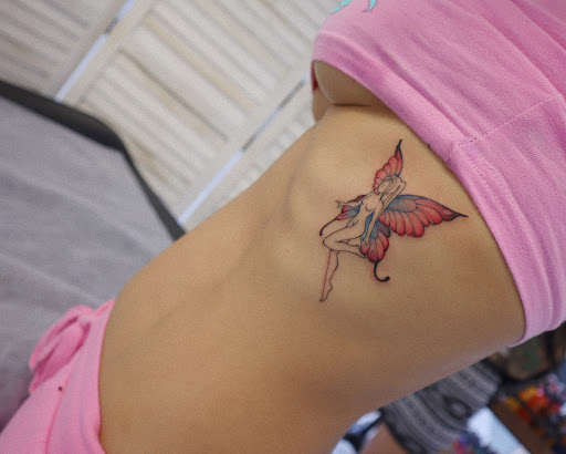 Explore let them hand tattoo ideas, creative tattoo ideas in Orange, available at Baron Art Tattoo