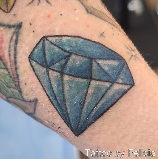 Explore wwe tattoo ideas, creative tattoo ideas in Fort Myers, available at Tiger Lotus Tattoo and Piercing