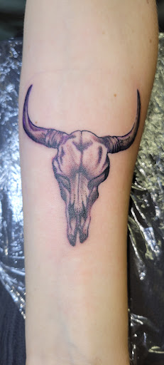 Explore hand print tattoo ideas, creative tattoo ideas in Angola, available at Hoodlum Ink