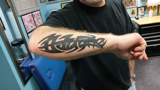 Explore tomahawk tattoo ideas, creative tattoo ideas in Glenside, available at Glenside Tattoo