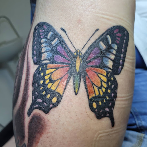 Explore simple thigh tattoo ideas, creative tattoo ideas in Angola, available at Hoodlum Ink