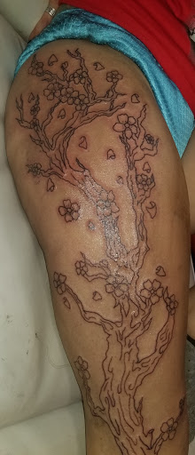 Explore spina bifida tattoo ideas, creative tattoo ideas in Onalaska, available at Divine Designs tattoo studio