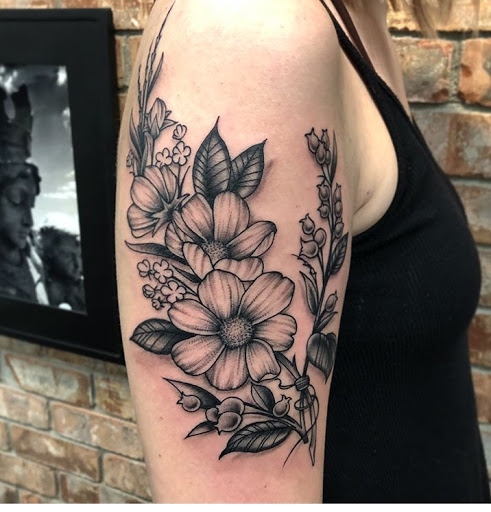 Explore black rose tattoo cover up ideas, creative tattoo ideas in Spokane, available at Anchored Art Tattoo