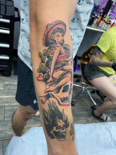 Explore banner tattoo ideas, creative tattoo ideas in El Paso, available at American Tattoo Society of Ft Bliss
