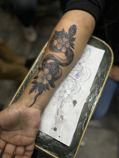 Explore invincible tattoo ideas, creative tattoo ideas in Sparks, available at Empire Tattoo