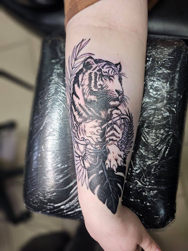 Explore ice hockey tattoo ideas, creative tattoo ideas in Sarasota, available at SEVEN SINS Tattoo Studio