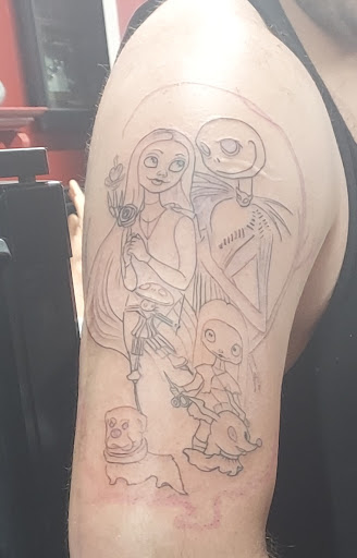 Explore lower tummy tattoo ideas, creative tattoo ideas in Flint, available at Millennial Ink- Tattoo Shop-Custom Tattoos-Top Tattoo Artist