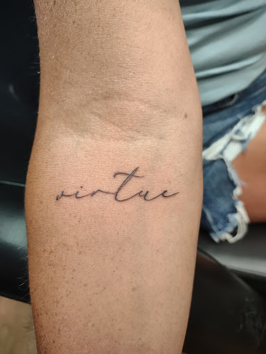 Explore ankle chain tattoo ideas, creative tattoo ideas in Williamston, available at Inkd Tattoo Parlor