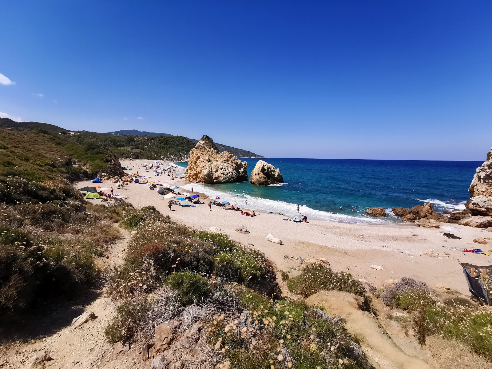 Foto av Melani secret beach med lätt fin sten yta