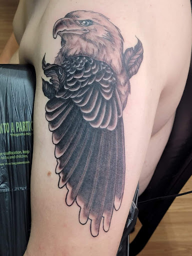 Explore eagle and flag tattoo ideas, creative tattoo ideas in Syracuse, available at Goblins Den Tattoo