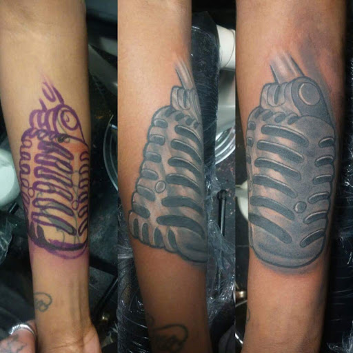 Explore upper arm tattoo ideas for men, creative tattoo ideas in Flint, available at Big Gunz Tattoos - Flint
