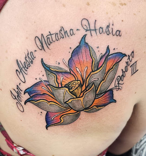 Explore women's lower back tattoo ideas, creative tattoo ideas in Toledo, available at 4 Nineteen Ink