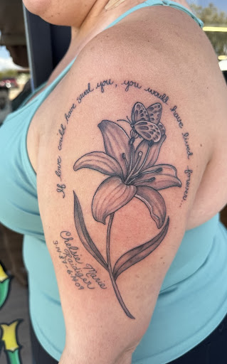 Find lion hand tattoo ideas for men for your next unique tattoo in Tucson at The Painted Lady Tattoo