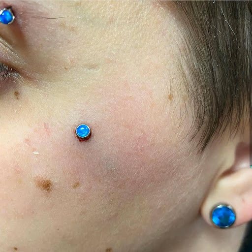 Explore back of the arm tattoo ideas, creative tattoo ideas in Charleston, available at Exotic Impressions Body Piercing