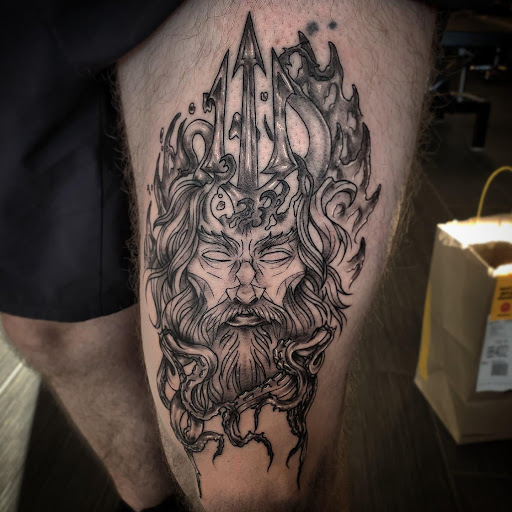 Explore compass tattoo ideas for men, creative tattoo ideas in Palm Harbor, available at Angry Owl Tattoo and Piercing