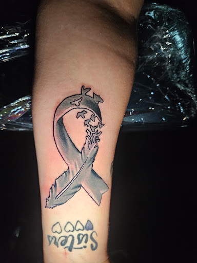 Explore cover up tattoo ideas on arm, creative tattoo ideas in Angola, available at Hoodlum Ink