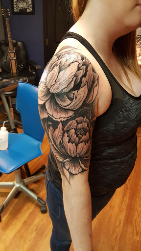 Explore female elbow tattoo ideas, creative tattoo ideas in East Freedom, available at Midnight Ink Tattoo Parlor