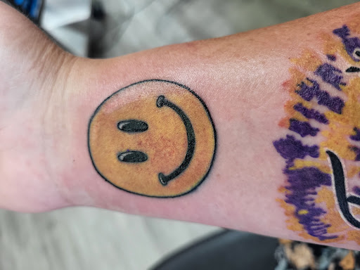 Explore caregiver tattoo ideas, creative tattoo ideas in Wickliffe, available at Distinctive Tattoo Studios