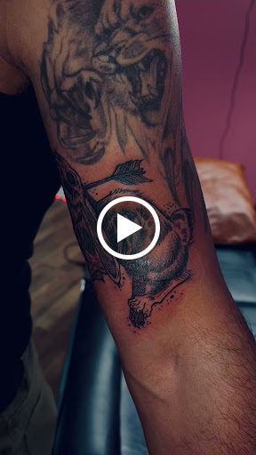 Explore small dog tattoo ideas, creative tattoo ideas in North Tonawanda, available at Dark Side Ink Tattoo Studio