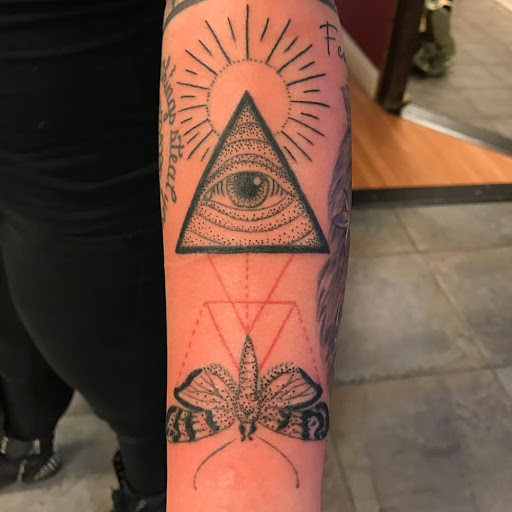 Explore dog collar tattoo ideas, creative tattoo ideas in Redding, available at The Salty Sloth Tattoo