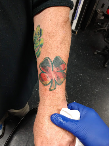 Explore neck tattoo ideas for woman, creative tattoo ideas in Spartanburg, available at The Gallery Tattoo Shop Spartanburg