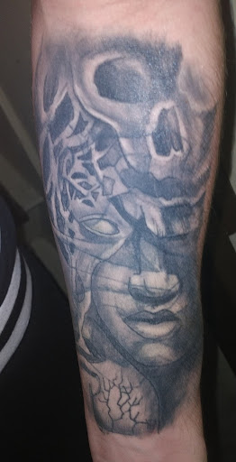 Explore arm tattoo cover up ideas, creative tattoo ideas in Cincinnati, available at Blue Magic Tattoo Lounge