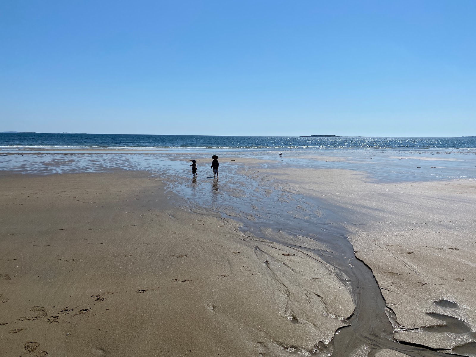 Valokuva Bayview beachista. pinnalla turkoosi puhdas vesi:n kanssa