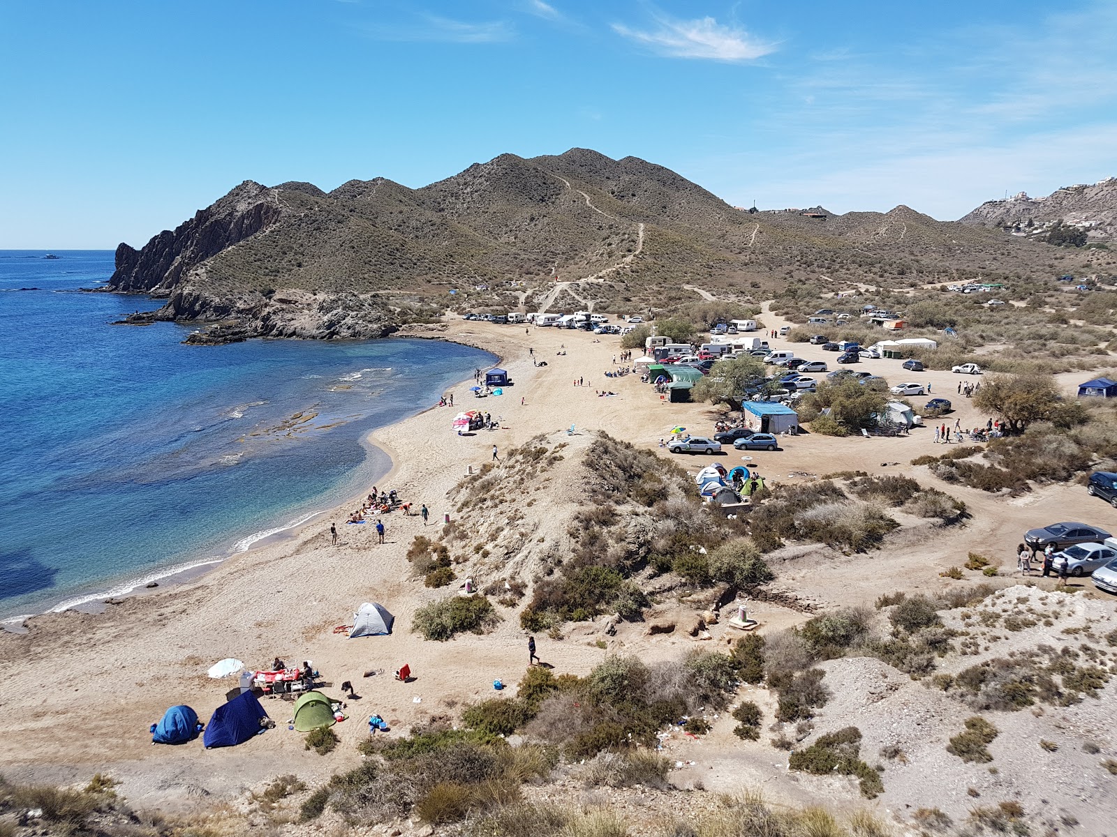 Foto di Playa del Arroz con una superficie del sabbia grigia