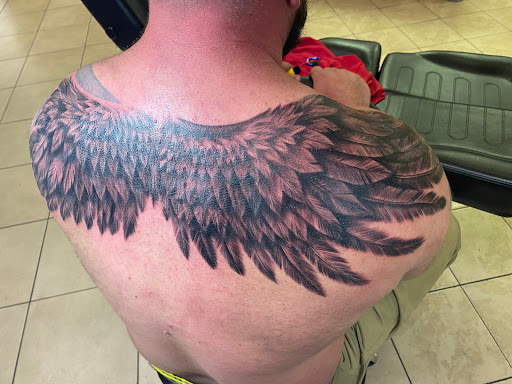 Explore back arm tattoo ideas, creative tattoo ideas in Holly Ridge, available at Evolution Tattoo Studio