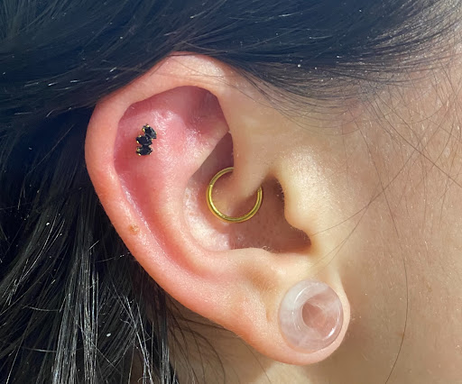 Explore november birth flower tattoo ideas, creative tattoo ideas in Marietta, available at The Queen Bee Tattoo and Piercing Parlour