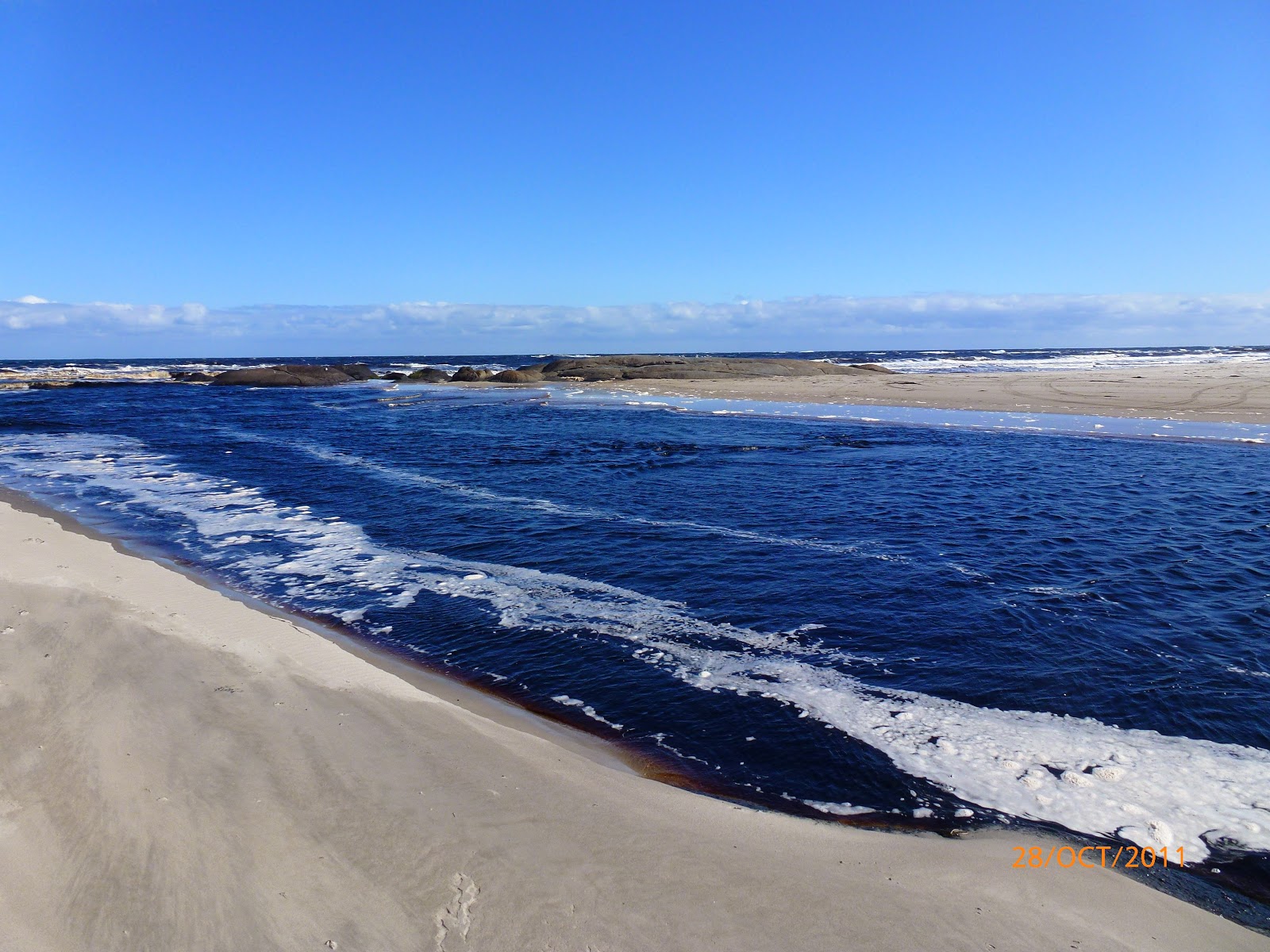 Fotografija Gardner Beach z svetel pesek površino