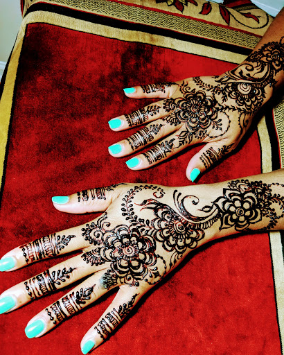 Find small tramp stamp tattoo ideas for your next unique tattoo in Concord at Naseera Fazil Henna Art