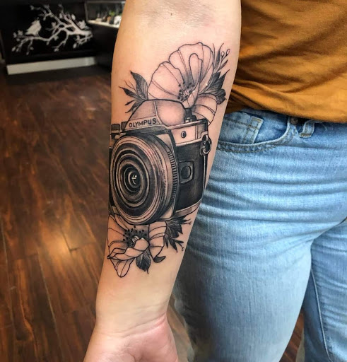 Explore clock hand tattoo ideas, creative tattoo ideas in Dubuque, available at The Crows Nest